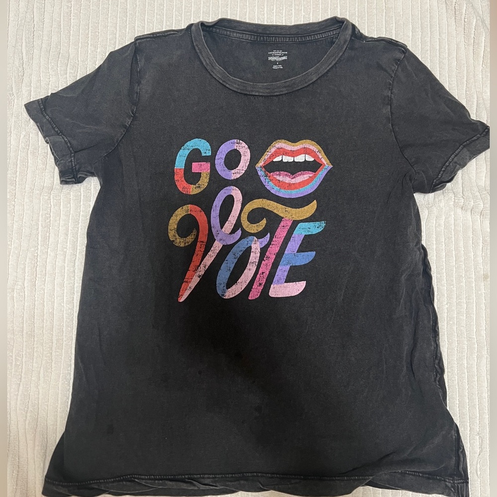 T-shirt size small.few small spots but probably can be treated.Looks vintage.